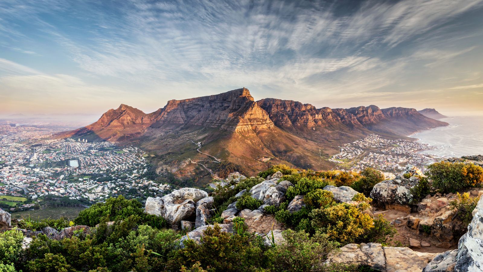 <p>Positioned between mountains and sea, Cape Town offers diverse adventures, from shark cage diving in Gansbaai to paragliding off Lion’s Head. </p><p>Hiking Table Mountain provides breathtaking views, while a short drive away, the Cape Winelands offer cycling tours amidst rolling vineyards. Safari tours to nearby game reserves offer encounters with Africa’s Big Five.</p>