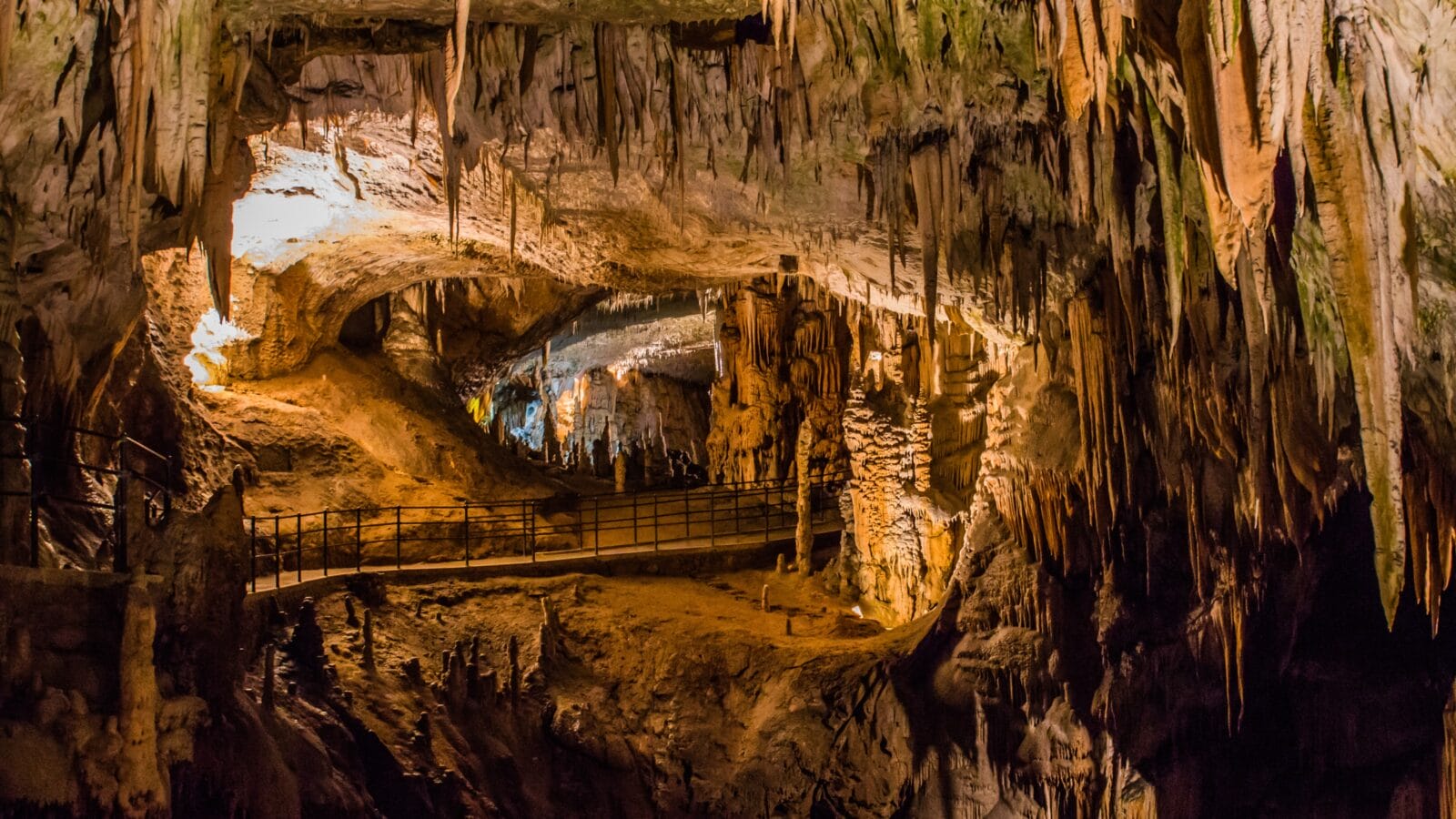 <p>Another awe-inspiring natural gem in central Europe is the Postojna Cave in the Mediterranean country of Slovenia. The cave system stretches 15 miles underground, with four caves connected by the same river.</p><p>Along with the Škocjan Caves, this mainstream destination remains one of the top-visited places in the country. Are you ready for its expansive subterranean halls, giant stalactites, and protruding age-old stalagmites? Don’t forget to say ‘hi’ to the baby dragons residing in the cave while you’re there!</p>