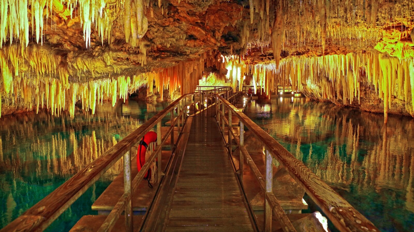 <p>Bermuda’s Crystal Caves and Fantasy Caves duo is a must-see destination for all cave lovers and visitors of the British island territory.</p><p>The crystal caves are famous for their floating pontoons, which lead you through the subterranean area under thousands of spectacular stalactites resembling chandeliers. While strolling through the cave, you’ll be surrounded by a crystal-clear underground lake. On the other hand, the nearby Fantasy Cave is a hidden gem comprising stunning formations and waterfalls frozen through time. The cave also offers a close look at its deep pools and walls glazed with mineral deposits.</p>