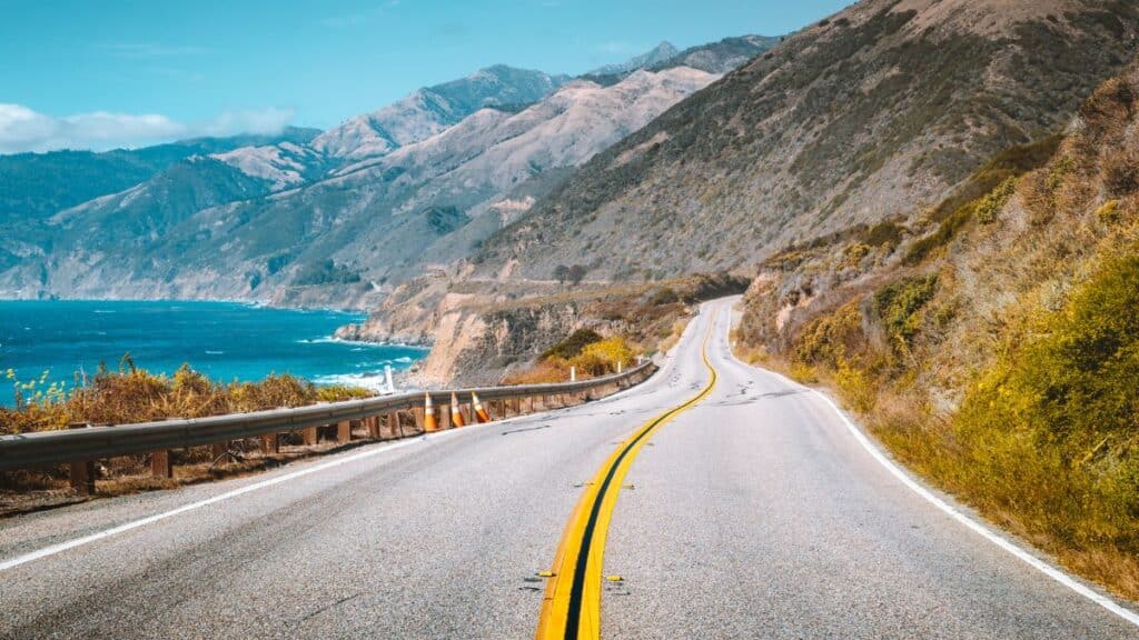 <p>The iconic coastal route Highway 1 runs from the tip of San Francisco to the southern edges of California. It’s a stretch filled with cliffside ocean vistas, beaches, and unique attractions like Hearst Castle. Pit stops at cozy towns like Carmel-by-the-Sea add charm to the journey.</p>