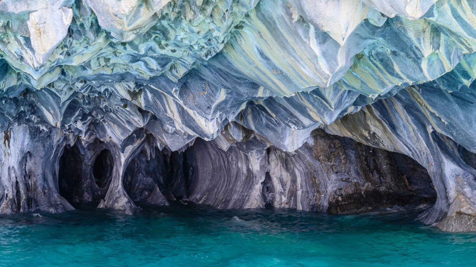 <p>The marble caves of Chile are a marvelous nature preserve and one of the world’s most unusual cave systems. Carved into the sides of the Patagonian Andes, they rest on a marble peninsula and border the ancient glacial lake of General Carrera, which played a crucial role in the cave system’s development.</p><p>While beauty is in the eyes of the beholder, it’s hard not to gaze at the cave’s cerulean pillars and naturally decorated ceilings with awe and respect for Mother Nature.</p>