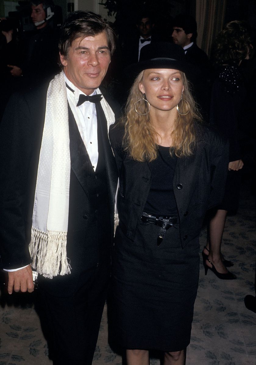 <p>The actress decided on an all-black 'fit for a late-’80s event. She posed for photos that evening in a belted black knee-length skirt, a matching black top, a buttoned blazer, and a textured hat. Her oversized silver earrings were a perfect accent for the otherwise straightforward look. </p>