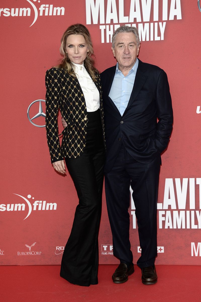<p>Pfeiffer may just be the queen of the blazer—the actress wore a gold-embroidered one with a pair of high-waisted flared trousers at the <em>The Family </em>premiere.</p>