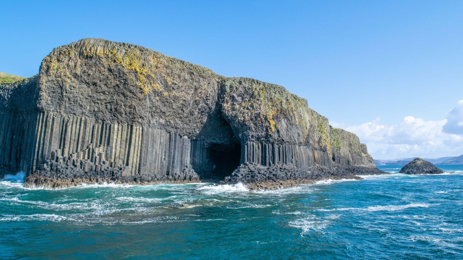 <p>Located on the uninhabited Scottish island of Staffa, Singal’s cave is part of a national nature reserve known for its natural acoustics. The spectacular sea cave has been a part of Scotland’s culture, art, and folklore since its discovery in 1772.</p><p>Besides its acoustics, Fingal’s Cave earns a place on this list thanks to its hexagonal basalt pillars caused by volcanic activity. After entering the cavern through its splendid, movie-like entrance, visitors are met by a majestic chamber fit for a royal dinner.</p>