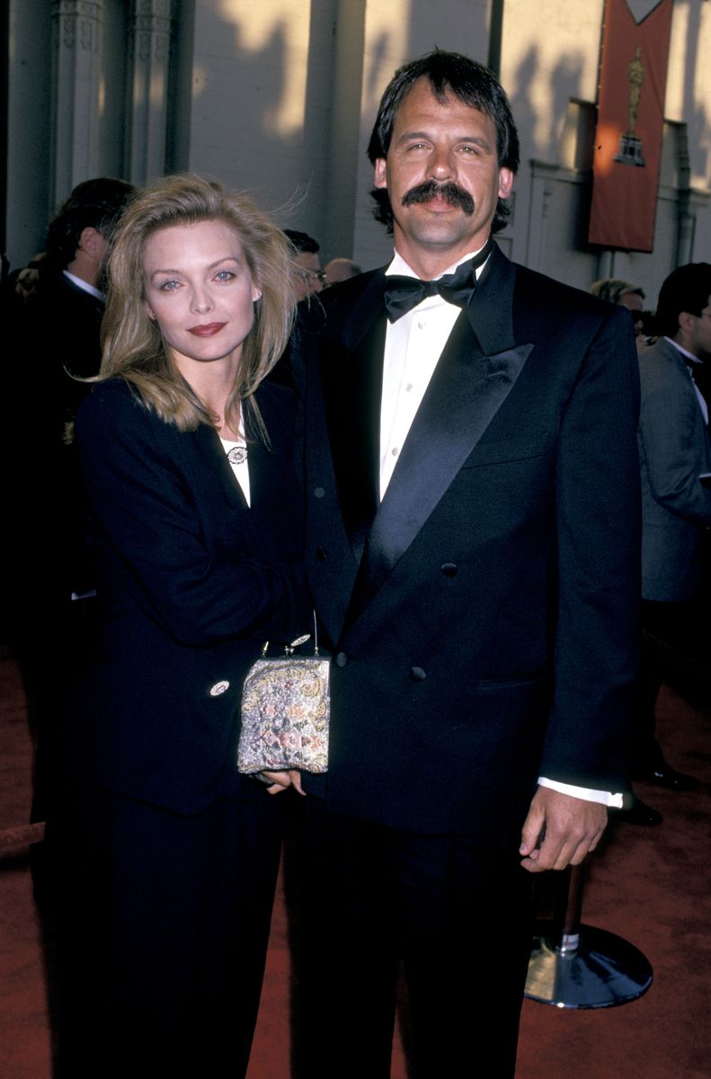 <p>Pfeiffer rocked a sleek and sophisticated look at the 1989 Academy Awards, where she was nominated for Best Supporting Actress thanks to her performance in <em>Dangerous Liaisons</em>. The dark red lip, the black suit, the straight, tousled hair—what's not to love?</p>