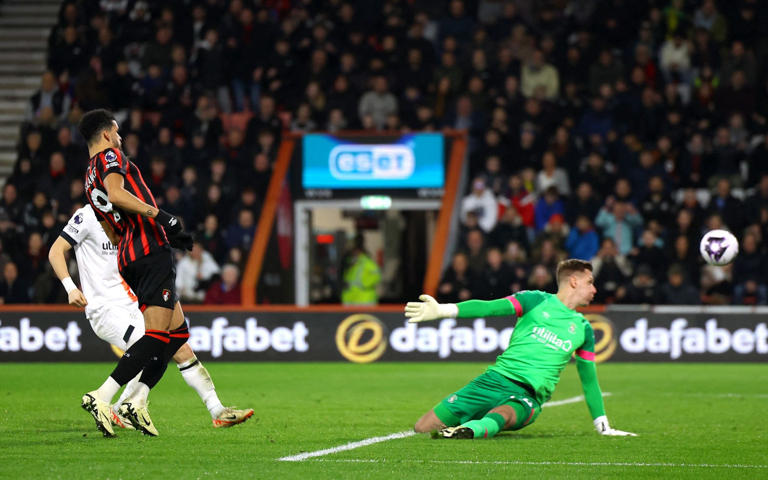 Dominic Solanke chips in Bournemouth's first of three goals in 14 second-half minutes that clawed their way to parity - REUTERS/Toby Melville