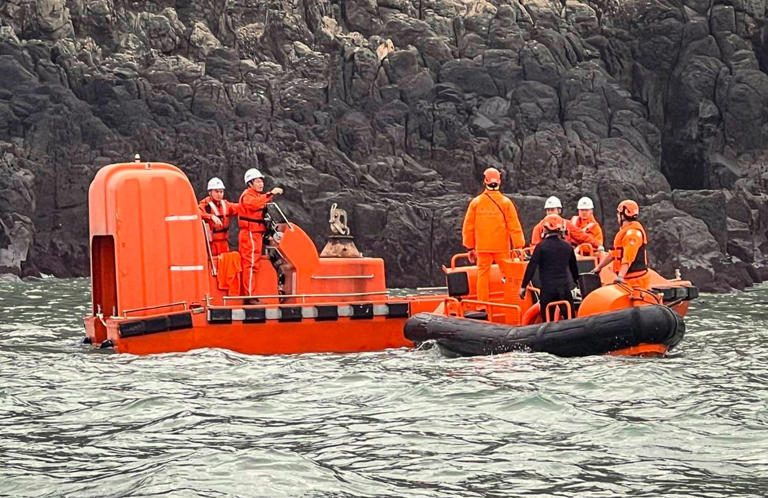 Taiwanese coastguards worked with their mainland counterparts to rescue six people from the capsized fishing boat from Fujian province. Photo: Reuters