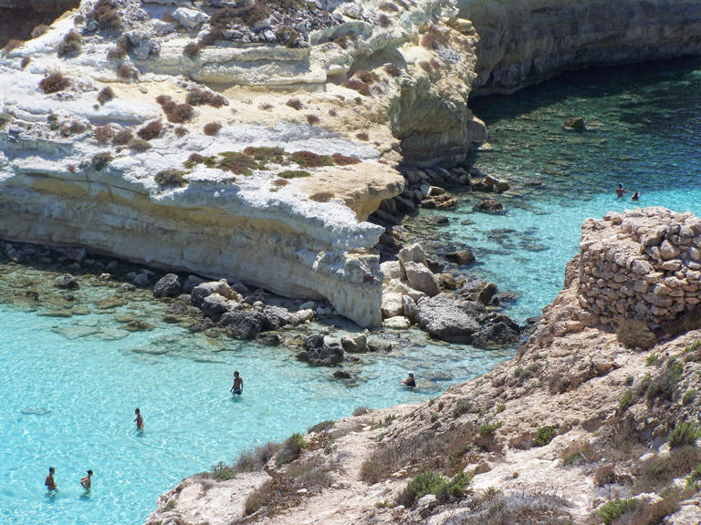 Spiaggia dei Conigli, also known as Rabbit Beach, is nestled on the stunning island of Lampedusa, Italy.
