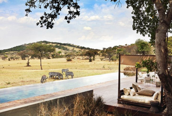 <p>If you haven’t been to the Mara, you have yet to taste true African luxury. Singita immerses you into the heart of the African wilderness with its thrilling game drives, the Great Wildebeest Migration, and lavish lodges with breathtaking views. For $1,800/night, you get an all-inclusive exploit, including meals, guided safaris, and park fees.</p>