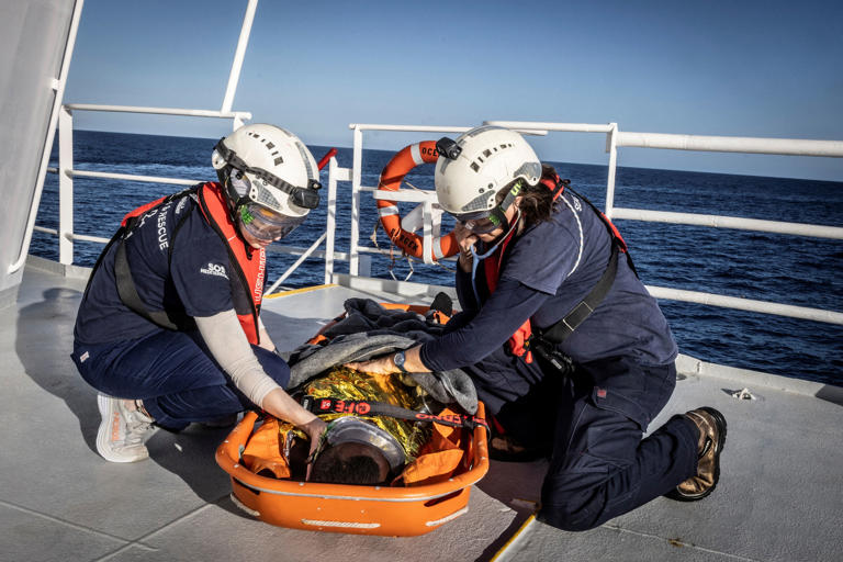 A survivor receives medical care onboard the rescue ship Ocean Viking [Johanna De Tessieres/SOS Mediterranee/Handout via Reuters]
