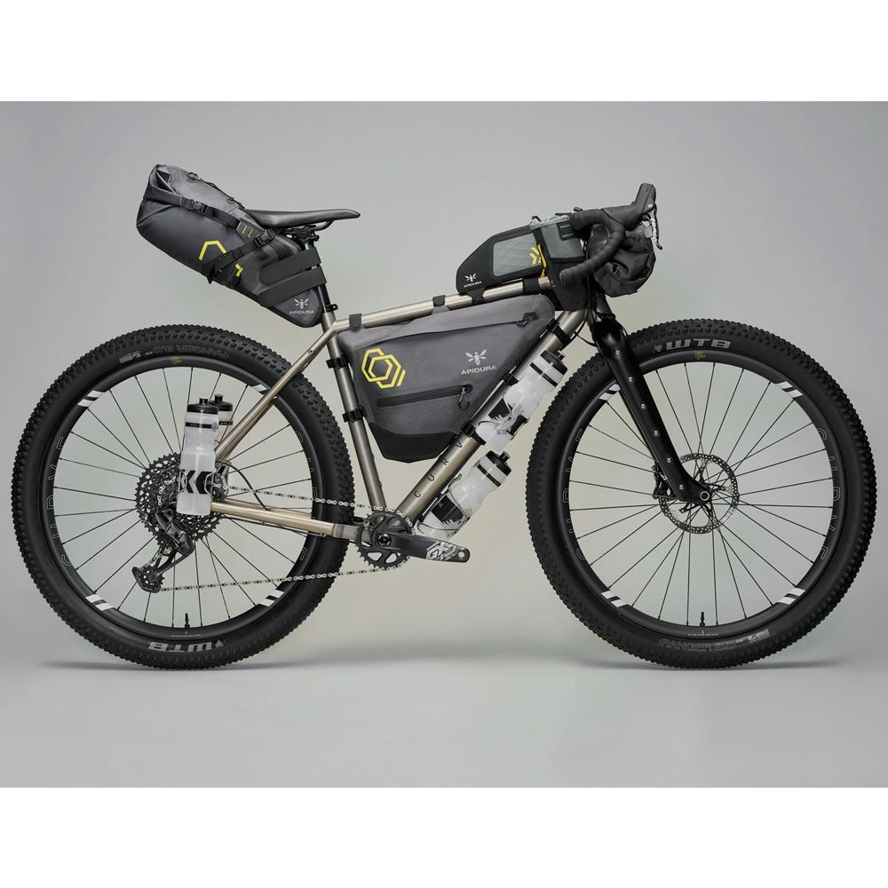 <p><strong>$4882.00</strong></p><p><a href="https://www.curvecycling.com/products/gmx-titanium">Shop Now</a></p><p>The Curve GMX+ Titanium has all the qualities I look for (and love) in a bikepacking bike. The titanium frame features a carbon fork and significant tire clearance, so you can swap tire widths if you want, depending on where you’re riding. There is an incredible number of mounts–four on the fork, and two for water bottles on either side of the downtube.</p><p>As I mentioned, I prefer <a href="https://www.bicycling.com/bikes-gear/a21784287/bike-frame-materials-explained/">titanium</a> frames because of their strength-to-weight ratio and toughness. I’ve also found that they’re excellent for absorbing road vibrations. (I’m always mildly shocked at the difference when I occasionally take my carbon racing bike out for a spin.) With elongated geometry, a substantial fork and wide handlebars, this bike inspires confidence no matter where you are; pavement, sand, washboard, rock or root-laden singletrack.</p><p>The GMX+ is incredibly versatile. It comes with a flared Walmer drop bar, but you can also outfit it with a flat bar if that’s your jam. It’s also available in a wide range of frame sizes and with many drivetrain options. It’s the closest you can get without going full custom.</p>