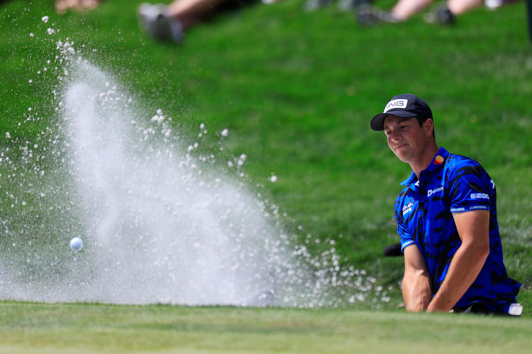 Viktor Hovland, hitting out of a bunker during the 2024 Players Championship, is the defending champion this week in the BMW Championship.