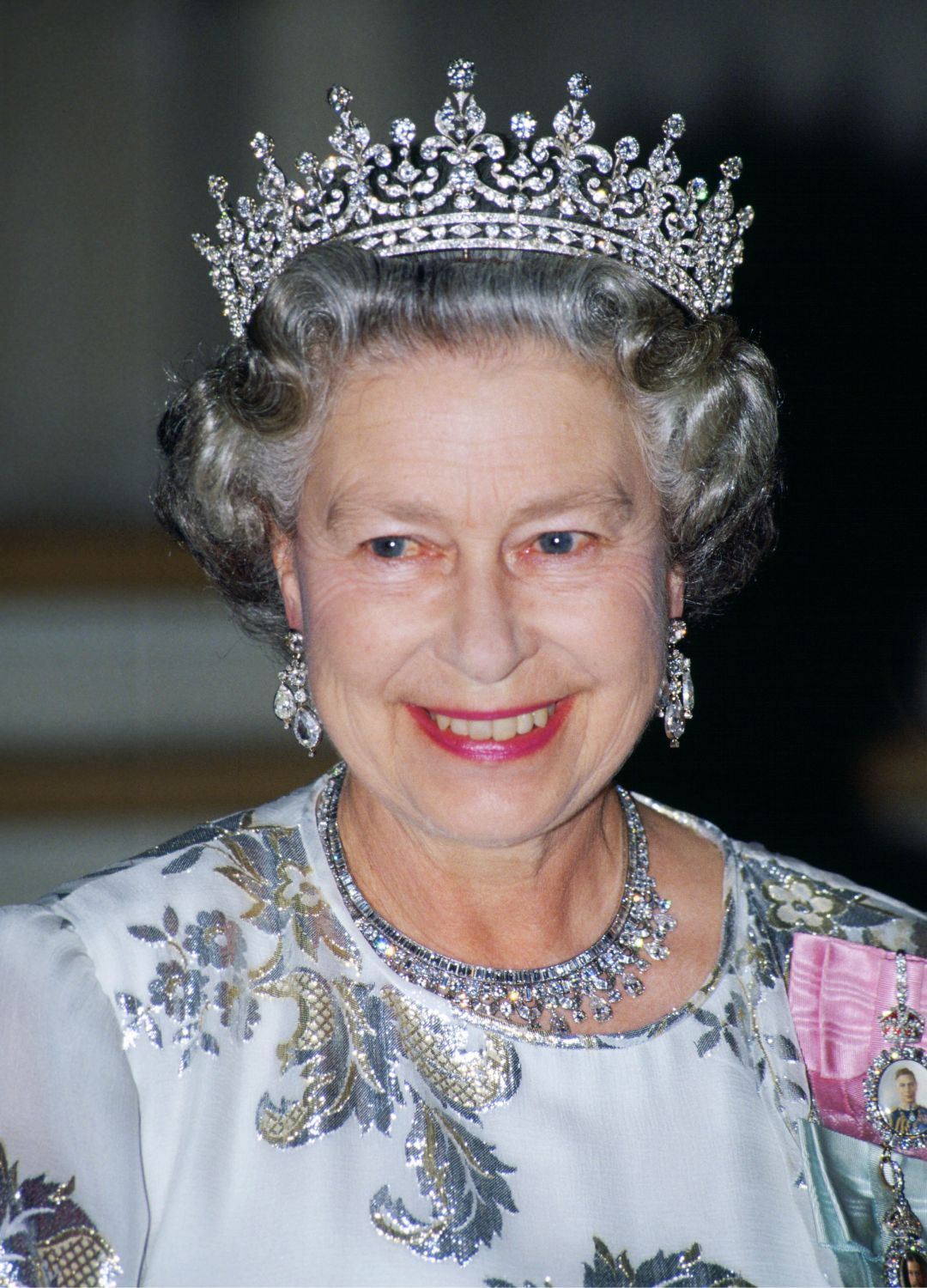 <p>                     Queen Elizabeth paired her white and silver embroidered evening dress with the iconic Queen Mary's Girls of Great Britain and Ireland tiara at a banquet in Paris in 2008. A vision in silver, she positively glowed in the statement tiara with matching diamond earrings and necklace.                   </p>