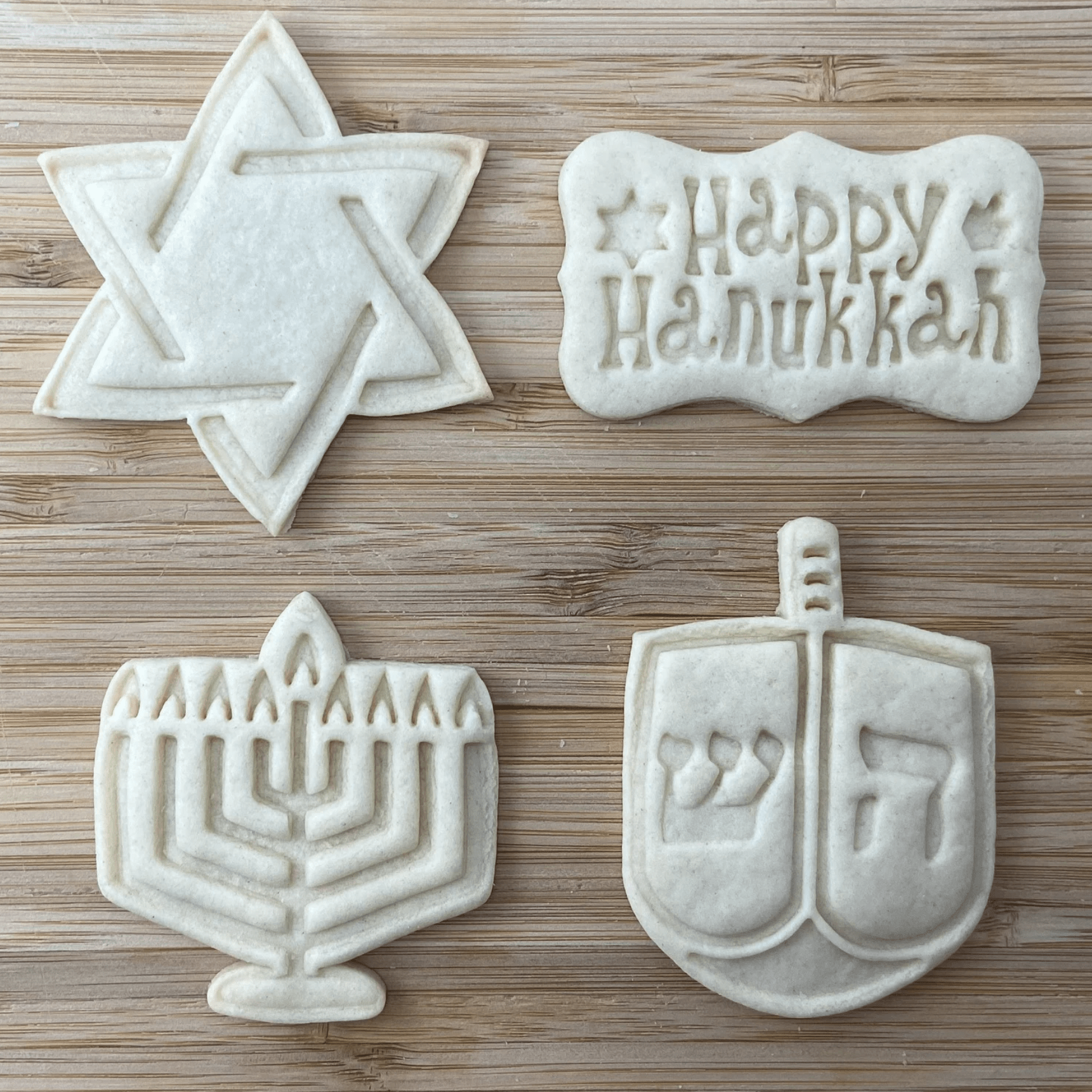 <p>Happy Hanukkah! Keep celebrations sweet with this <a href="https://www.etsy.com/listing/632220610/hanukkah-cookie-cutters-and-presses" rel="noopener">Hanukkah cookie cutter and press set</a>. Choose from four designs: Dreidel, Menorah, happy Hanukkah and Star of David. Or, score all four for an extra bright Festival of Lights cookie decorating party. Pair them with the <a href="https://www.tasteofhome.com/collection/best-hanukkah-decorations/">best Hanukkah decorations</a> to take all eight nights to the next level.</p> <p class="listicle-page__cta-button-shop"><a class="shop-btn" href="https://www.etsy.com/listing/632220610/hanukkah-cookie-cutters-and-presses">Shop Now</a></p>