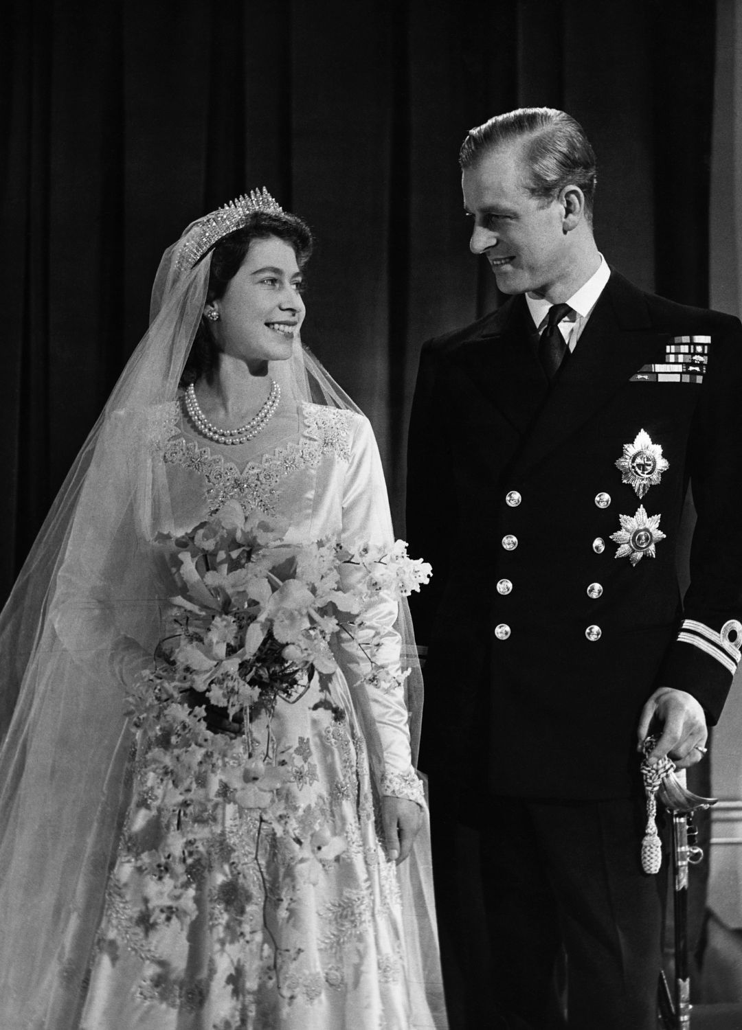 <p>                     Posing for perhaps one of the most iconic wedding pictures ever taken (and one of the most romantic royal moments!), the then Princess Elizabeth wore the Queen Mary Fringe tiara as a 'something borrowed' token. A token, which she had been lent from her mother Queen Elizabeth, that immediately snapped before her 1947 wedding and had to be emergency repaired by the on-hand court jeweller.                   </p>