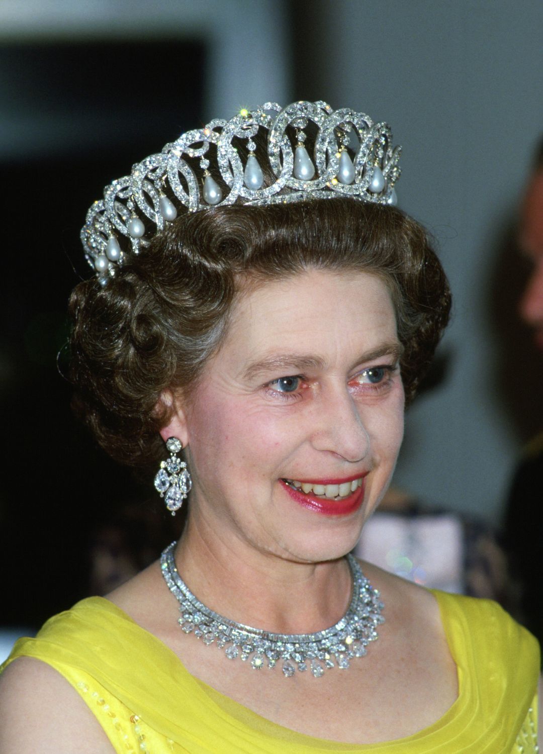 <p>                     This ornate tiara has had many lives and owners. It was first bought by Queen Mary from Grand Duchess Elena Vladimirovna of Russia in 1921 and was originally made with 15 large drop pearls. However, when Queen Mary purchased the tiara she had it altered so that it could also accommodate 15 emeralds. Interestingly, the tiara can now be worn either way with both pearls and emeralds.                   </p>