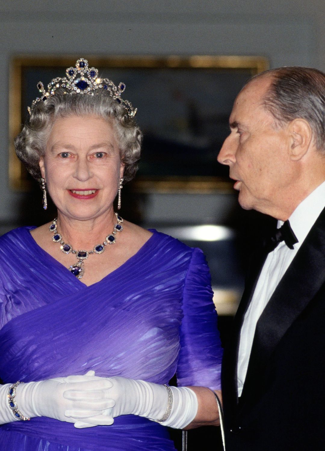 <p>                     During a banquet on board the Royal Yacht Britannia in France, the late Queen wore the King George VI Victorian suite of sapphire and diamond necklace with matching earrings. Her tiara, made to match the jewellery, looked exquisite with her dark blue satin dress and white evening gloves.                   </p>