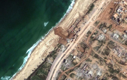 A satellite image Thursday shows a new jetty under construction along the coastline just south of Gaza City.