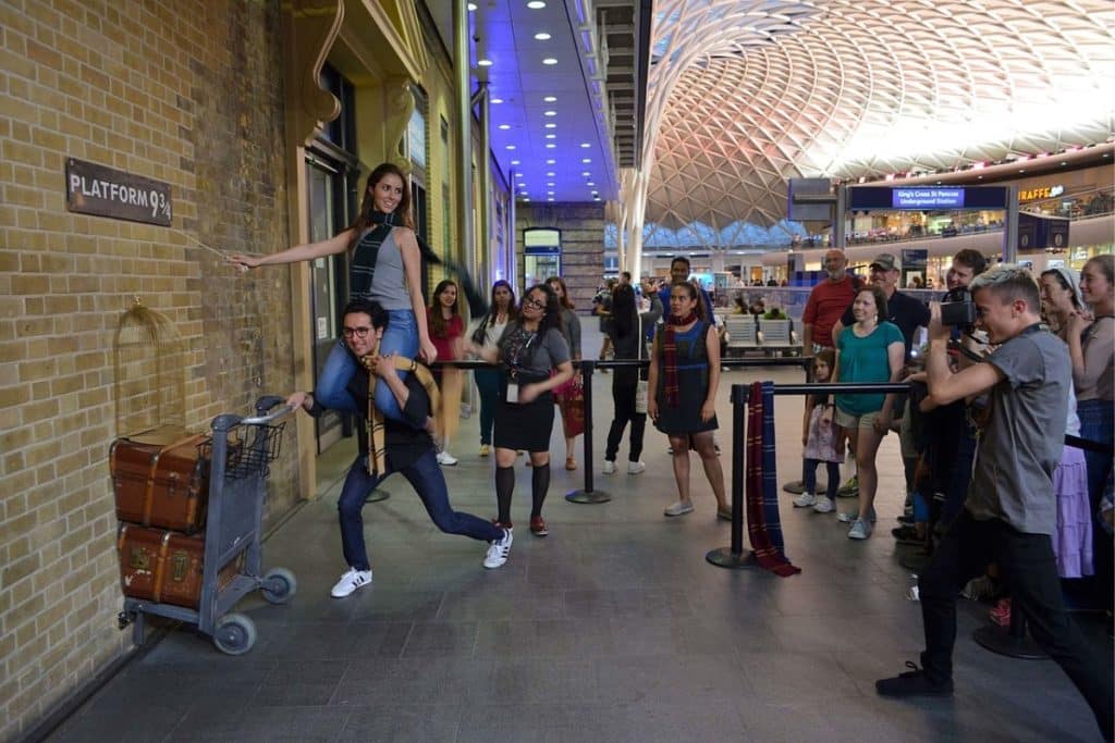 <p>For Harry Potter fans, a visit to Platform 9¾ at King’s Cross Station in London is a must. Although the magical platform itself may not exist, the station has a dedicated area complete with a luggage trolley embedded in the wall, allowing fans to recreate their own Hogwarts departure.</p>