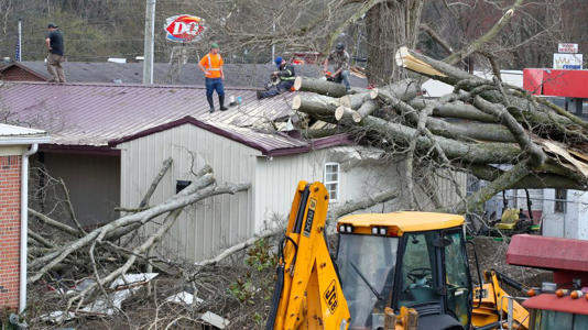 Crews work to clean up after a reported tornado touched down Thursday in Milton, Kentucky. - Michael Clevenger/Courier Journa/USA Today Network