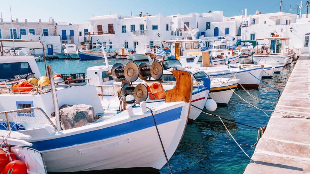 <p>Paros is a small island packed with everything you could want for a perfect getaway. Surrounded by famous nearby islands like Mykonos and Santorini, it often gets overlooked. </p><p>This tiny island is filled with mini adventures, from its stunning Cycladic architecture to a raging nightlife to some of the best beaches in Greece. With two main villages, Parikia and Naoussa, the island also has impressive local tavernas and several restaurants and bars to immerse yourself fully. </p><p>The best way to enjoy the place is to get a pump of adrenaline as you enjoy sports like windsurfing and kitesurfing. Your vacation would be incomplete without them.</p><p class="has-text-align-center has-medium-font-size">Read also: <a href="https://worldwildschooling.com/best-traditional-greek-foods-to-try-in-greece/">Must-Try Traditional Greek Foods</a></p>