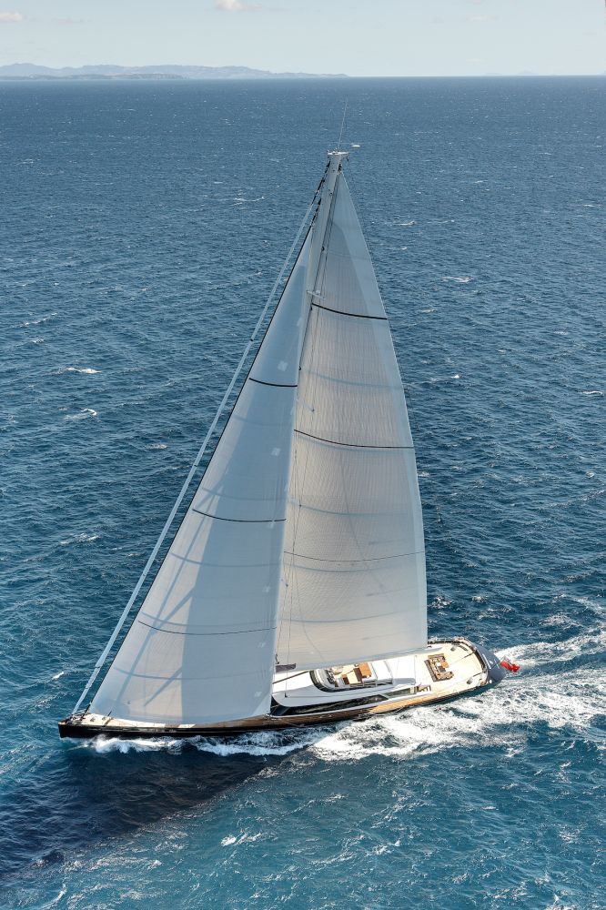 <p>When <em>Kokomo</em> was launched, she was the second-largest sloop in the world and carried the largest set of sails made by Doyle Sails in New Zealand. The 23,971-square-foot asymmetric spinnaker is half the size of a professional football field, while the 9,688-square-foot mainsail needs a crane to lift it. Because of the gargantuan size of the sails, the designers entered a new era of spar and winch design, having to “reinvent” the deck equipment—winches, mast, boom, rigging and sails—to cope with the 31.6-ton load on the genoa sheet and 32-ton load on the main sheet clew. The 244-foot carbon mast is the largest ever made by Southern Spars.</p>