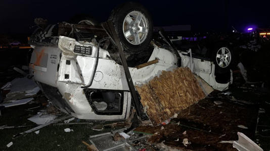 An overturned vehicle in Winchester, Indiana, after severe weather impacted the area Thursday. - Bill Kirkos/CNN