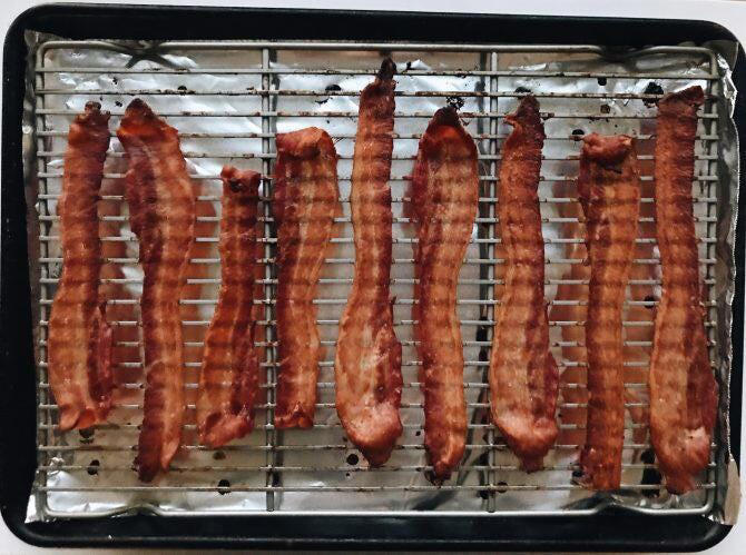 It's fine if the bacon strips touch since they'll shrink and shrivel while cooking.