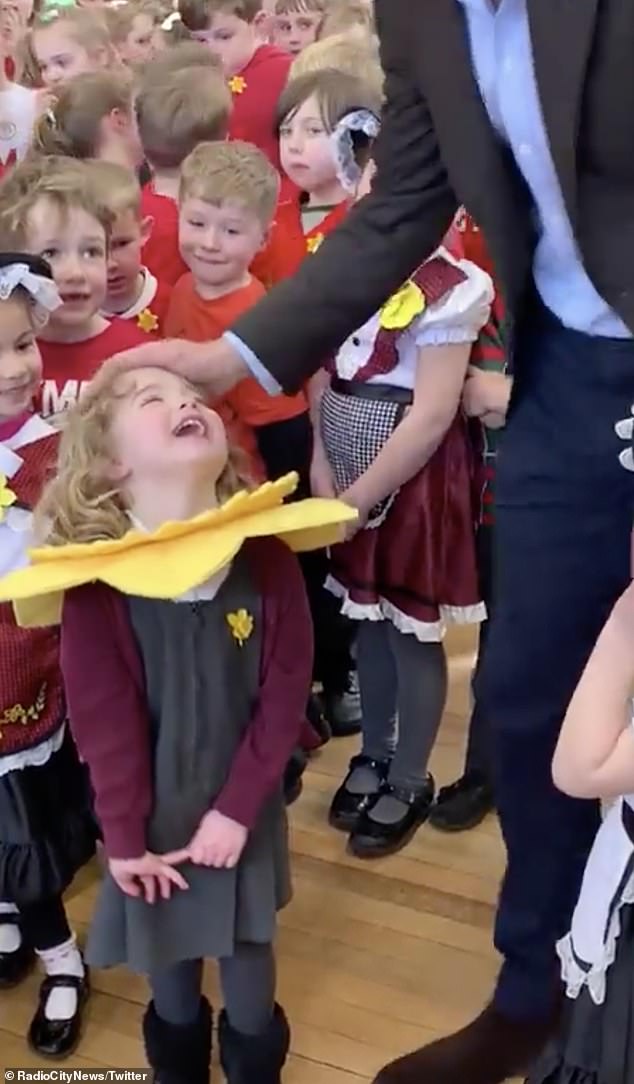 adorable moment 4-year-old girl bashfully beams as prince william compliments her daffodil outfit during school visit to mark st david's day in wrexham