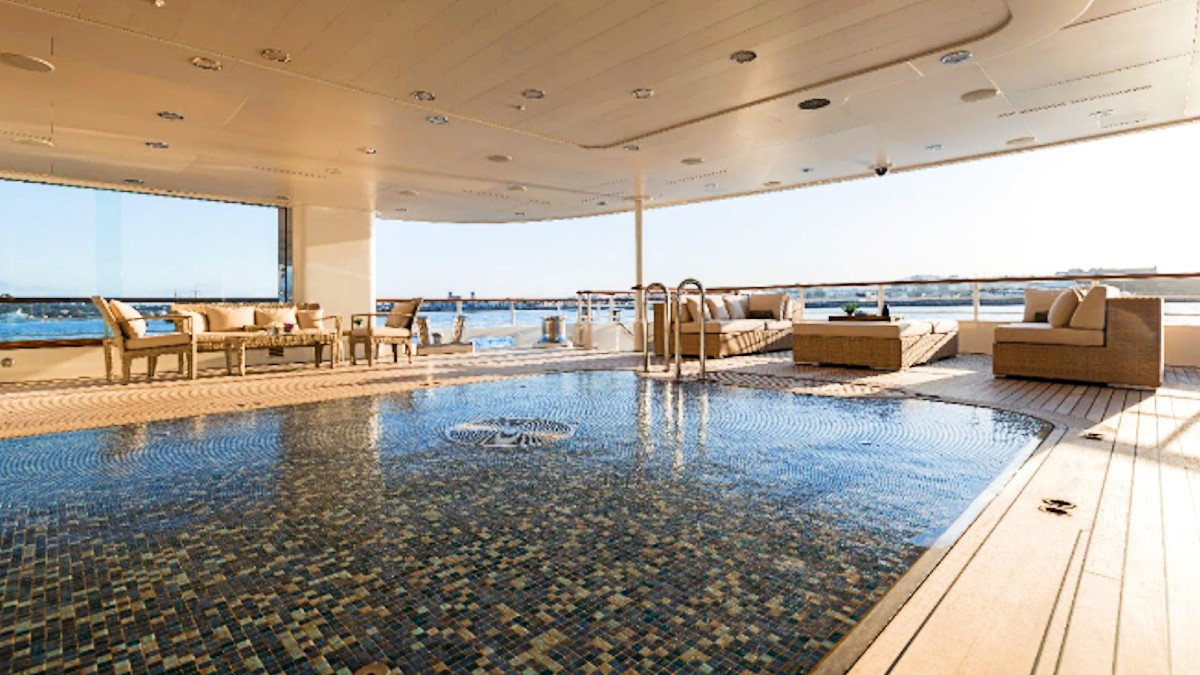 <p>It takes nearly 10,600 gallons of water to fill the 200-square-foot heated swimming pool on the main deck aft. A variable current allows guests to swim long distances. Come evening, the pool floor raises flush to the deck, transforming into a dance floor.</p>