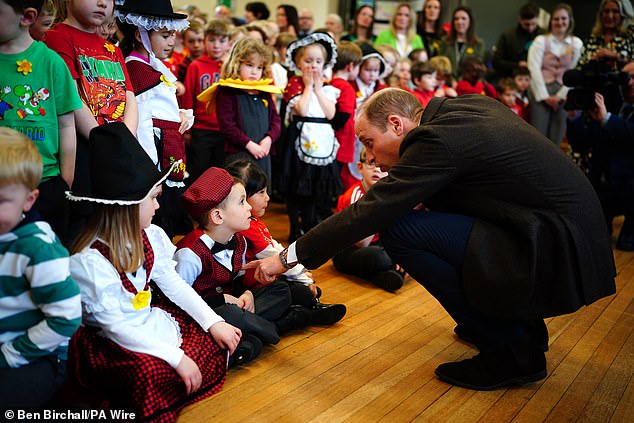 adorable moment 4-year-old girl bashfully beams as prince william compliments her daffodil outfit during school visit to mark st david's day in wrexham