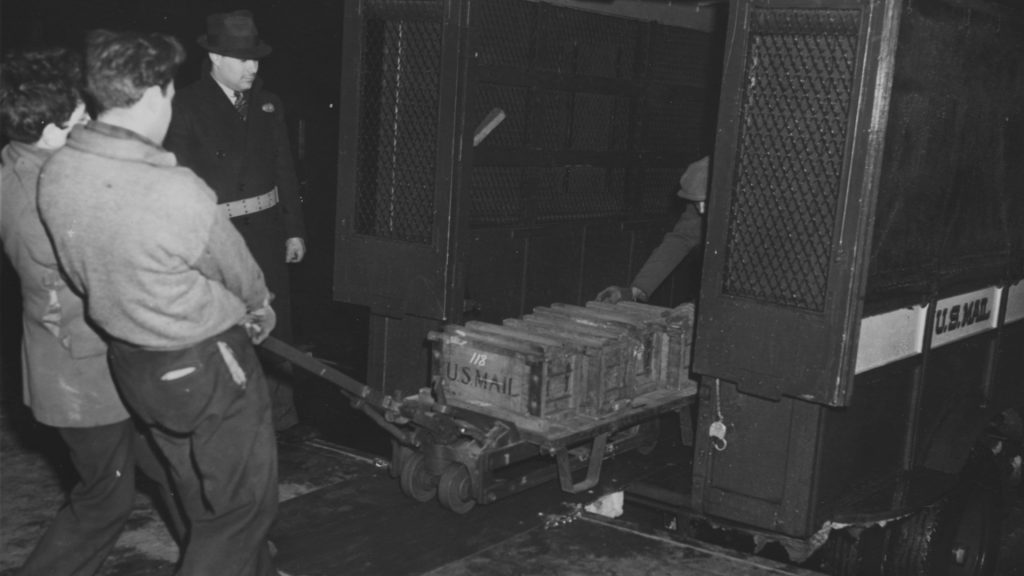 <p>When the bullion depository at Fort Knox was complete in 1937, the Treasury then had to transport gold bars from New York and Philadelphia to Kentucky. They didn't load the gold bars in a rail car or a semi-truck. Instead, they mailed the gold to Kentucky.</p><p>As amazing as it sounds, it is true. The Treasury department reached out to the U.S. Post Office to oversee the delivery of the gold. The Post Office utilized reinforced postal trucks to transport the gold from the mints in New York and Philadelphia to armored train cars.</p>