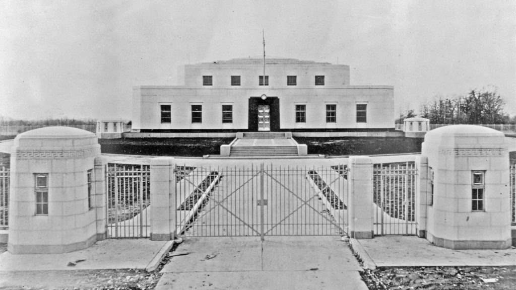 <p>The bullion depository is well-guarded from the exterior, as well. A perimeter fence topped with razor wire surrounded the entire building. There is even a minefield between the perimeter fence and the building.</p><p>The Fort Knox security staff have their eyes and ears on the depository building at all times. Literally. High-resolution security cameras with night vision capabilities and a hidden network of ultra-sensitive microphones are hidden throughout the grounds.</p>