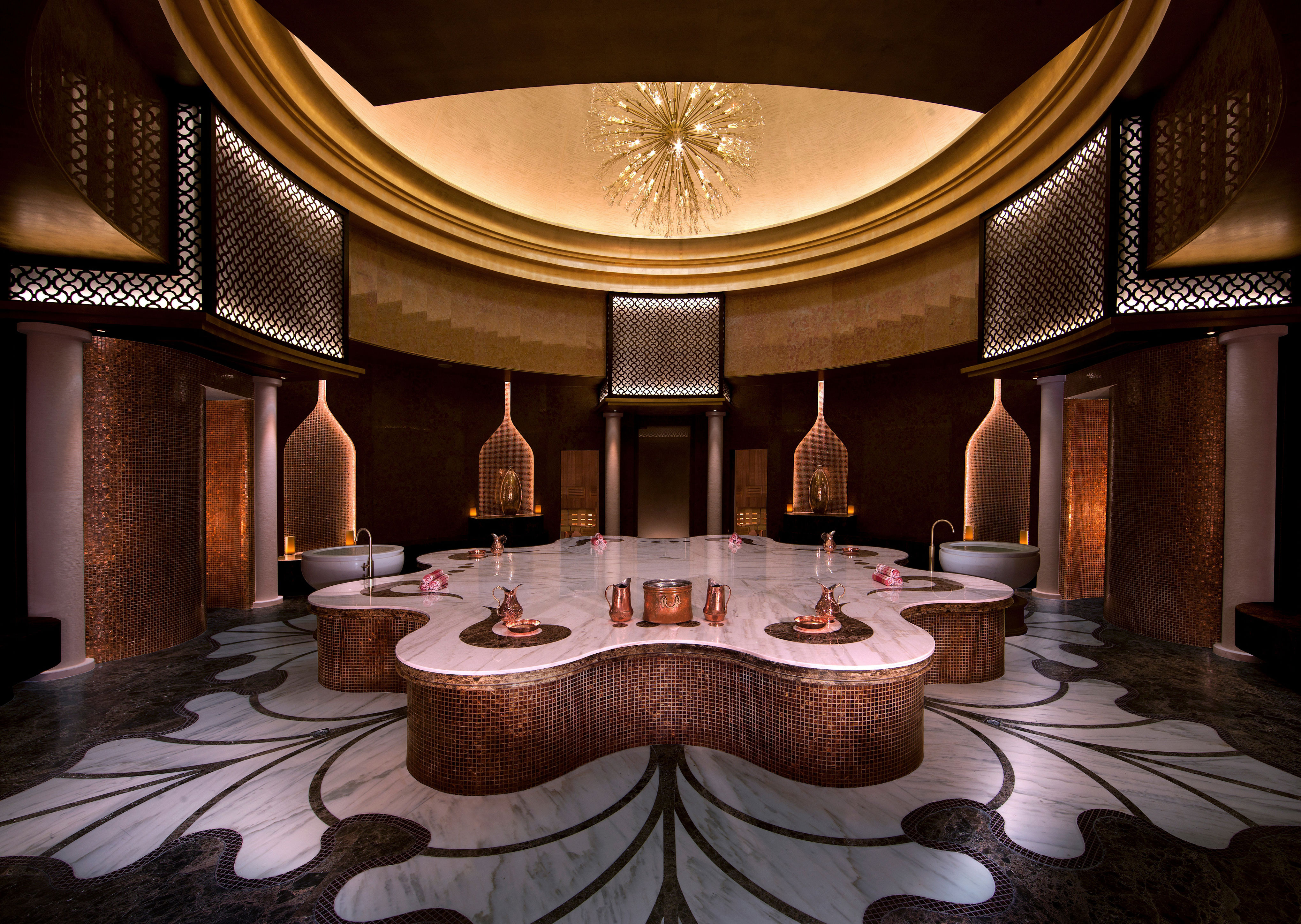 <p>Though the waterfront hotel’s outdoor jacuzzis, serene relaxation rooms, and in-suite soaking tubs offer opulent digs in which to unwind, <a href="https://www.anantara.com/en/eastern-mangroves-abu-dhabi">Anantara Eastern Mangroves</a>’s sumptuous Turkish hammam experience is the undeniable crown jewel of its many spa amenities. A heated marble pedestal, the sides of which are clad in a rich brown mosaic tile, anchors the sanctuary. Guests are guided through a menu of traditional wellness rituals by hammam specialists, including kese mitt exfoliation, honey face masks, and olive oil massages.</p> <div class="callout"><p><a href="https://www.expedia.com/Abu-Dhabi-Hotels-Anantara-Eastern-Mangroves-Abu-Dhabi-Hotel.h4921123.Hotel-Information" title="Book now at Expedia.com">Book now at Expedia.com</a></p> </div><p>Sign up for our newsletter to get the latest in design, decorating, celebrity style, shopping, and more.</p><a href="https://www.architecturaldigest.com/newsletter/subscribe?sourceCode=msnsend">Sign Up Now</a>
