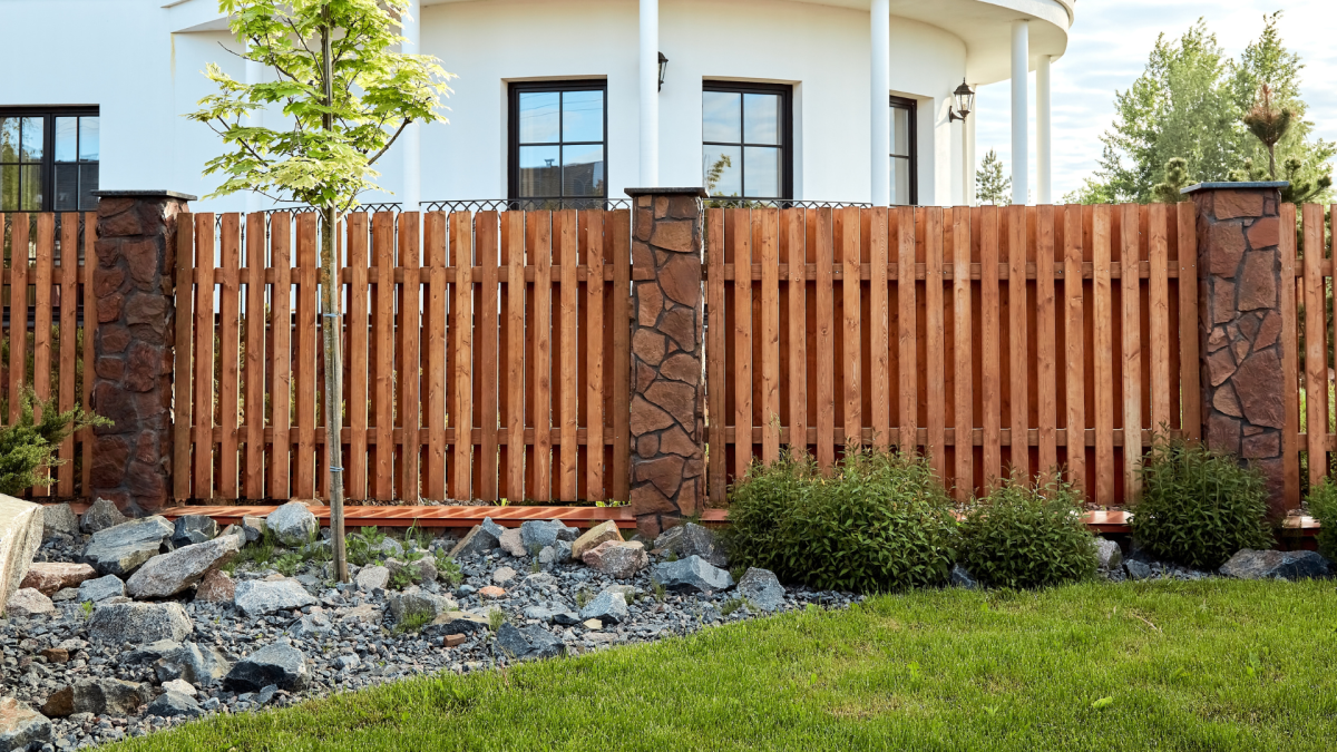 homeowners paint their fence black and the results speak for themselves
