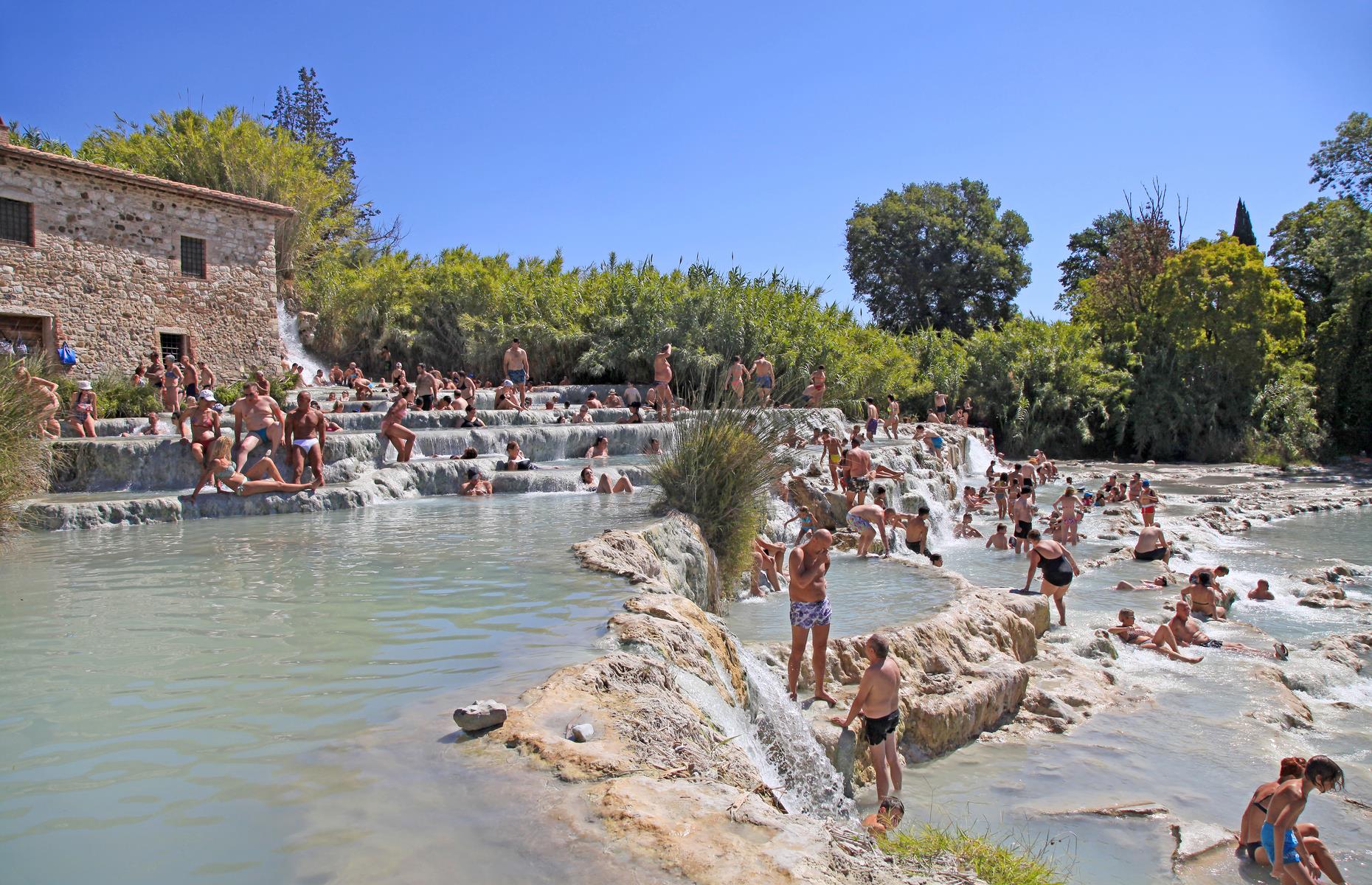 <p>Italians have floated in these naturally carved pools since Roman times in the firm belief that the thermal waters have healing properties. Wallow in the 99°F waters as you gaze out over the Tuscan countryside. Best of all, entry is free. You’ll find Cascate Del Mulino just outside Saturnia. </p>