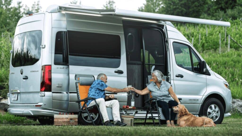 <p>This smallest RV with shower and toilet covers all your basic needs but also provides you with features such as seat belts for four and a roomy lounge area. You can do day trips with your friends, cook lunch on the beach and take your entire family camping.</p><p>We love that this campervan with a bathroom is 4WD so you can go almost anywhere.</p><p>The bed has push-button control and flattens out to a large 66″ x 73″. You’ll also enjoy hot water, an LED widescreen TV and spacious, versatile bathroom. The wet bath in this smallest <a href="https://www.thewaywardhome.com/best-class-b-rvs/">Class B RV</a> with shower and toilet also includes a sink, built-in shampoo, conditioner and body wash stations. There’s even a clothesline!</p>