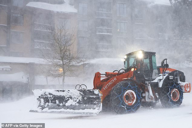 monster blizzard causes mayhem on the roads as california and nevada are battered by 190 mph winds - with highways closed due to collisions, hundreds of cars stranded and 12 feet of snow forecast