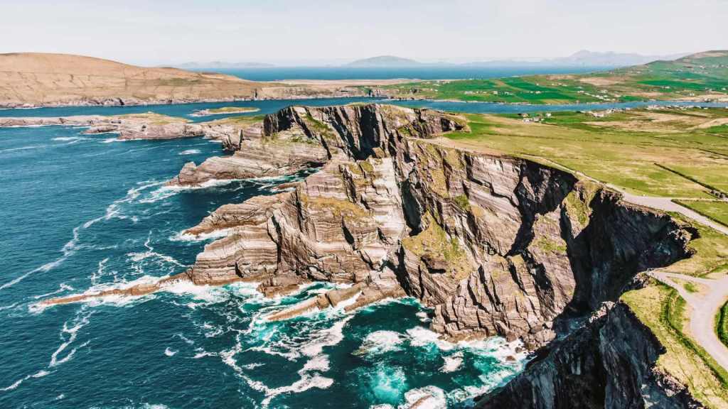 <p>Experience the magic of the Emerald Isle by exploring the scenic Ring of Kerry in Ireland. This 111.22-mile (179-kilometer) long route is ideal for those seeking stunning landscapes, cultural richness, and historical immersion.</p><p>A road trip on this route takes travelers through charming Irish villages, including Killarney, Kenmare, and Sneem. These villages provide opportunities to experience local culture and enjoy traditional Irish hospitality.</p><p>Also, this road is in a region with ancient ringforts and stone circles, such as Cahergall Stone Fort and Staigue Fort. These archaeological sites add a sense of mystery and historical intrigue to the journey.</p><p class="has-text-align-center has-medium-font-size">Read also: <a href="https://worldwildschooling.com/hidden-european-islands/">Hidden Islands in Europe</a></p>