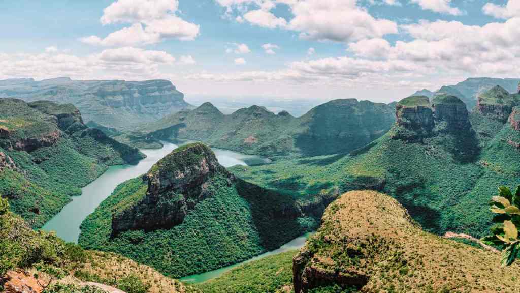 <p>Panorama Route is a scenic road showcasing the Mpumalanga province’s natural beauty. It offers awe-inspiring views of the Drakensberg Mountains and the Blyde River Canyon, the third-largest canyon in the world.</p><p>A must-visit viewpoint along the route, God’s Window provides a panoramic view of the Lowveld and the distant Lebombo Mountains. On a clear day, you can see as far as Kruger National Park.</p><p class="has-text-align-center has-medium-font-size">Read also: <a href="https://worldwildschooling.com/must-visit-cities-in-the-world/">Must-Visit Cities in the World</a></p>
