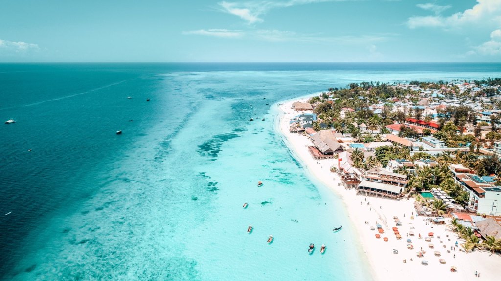 <p>One of the most sought-after spots in Zanzibar, Nungwi is adored for its serenity and picture-perfectness. Located in the Northern part of Zanzibar, Nungwi is a tropical haven known for its pristine white sands, clear turquoise waters, and vibrant marine life. </p><p>The white sands stretch for miles and miles on the Indian Ocean, making it the perfect location to go sunbathing. You could also enjoy marine wildlife watching, which is easy to spot at Nungwi. </p><p class="has-text-align-center has-medium-font-size">Read also: <a href="https://worldwildschooling.com/most-beautiful-places-in-the-world/">Most Beautiful Places in the World</a></p>