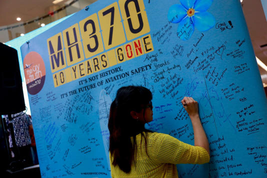 Relatives of passengers from the Malaysia Airlines flight that mysteriously vanished 10 years ago are writing messages at the Day of Remembrance for MH370 on March 3, 2024 (Picture: Shutterstock)