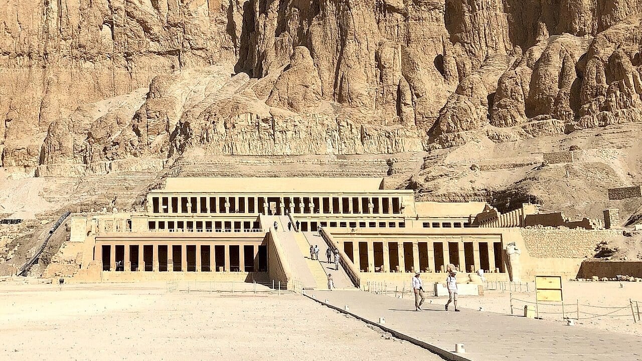 <p>Located in Luxor, this temple was built to honor the first female pharaoh of Kemet. Archeologists are always discovering relics in the tombs beneath them, a testament to the power and rich culture of the Ancient rulers. Decorated with many reliefs depicting Hatshepsut’s reign, the temple built into a cliff contains a sanctuary dedicated to Amun-Ra, the Egyptian god of the Sun.</p>