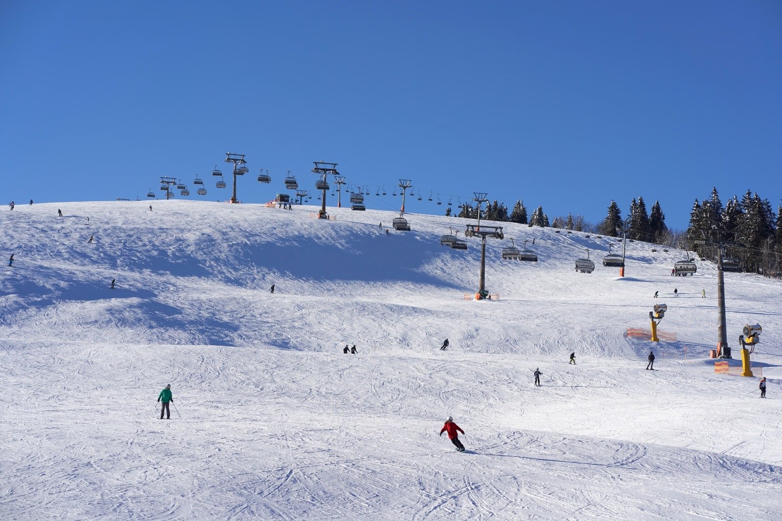 <p><span>Feldberg, the highest peak in the Black Forest, is a paradise for outdoor enthusiasts. In winter, it transforms into a popular ski destination, with slopes catering to all levels of skiers and snowboarders. The mountain also offers opportunities for snowshoeing and cross-country skiing.</span></p> <p><span>In summer, Feldberg’s lush meadows and clear skies make it perfect for hiking, mountain biking, and paragliding. The Feldberg Nature Discovery Park provides informative trails about the local flora and fauna.</span></p> <p><span>From the summit, you can enjoy panoramic views that stretch across the Black Forest and into the Alps on clear days. </span><span>Whether blanketed in snow or basked in sunshine, Feldberg offers a range of activities and breathtaking scenery year-round.</span></p> <p><b>Insider’s Tip: </b><span>For a unique experience, try snowshoeing in winter to explore the mountain’s quieter, snow-covered paths.</span></p> <p><b>How To Get There: </b><span>Feldberg is accessible by car or bus from Freiburg or Titisee.</span></p> <p><b>Best Time To Travel: </b><span>Winter is for skiing and snowboarding, and summer is for hiking and nature walks.</span></p>