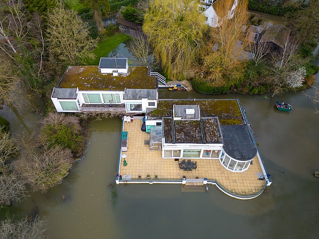 debbie mcgee is forced to move out of £3million berkshire mansion as it floods again after banks of the thames burst around luxury home she shared with her late tv magician husband paul daniels