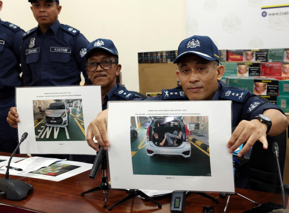 johor customs say nabbed singaporean man in car boot attempting to enter malaysia in december