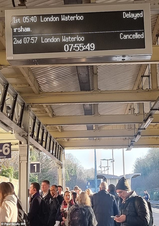 major rail line into london is blocked after train hit an object on the track and derailed - with passengers facing 'do not travel warning' on first working day of fares increase
