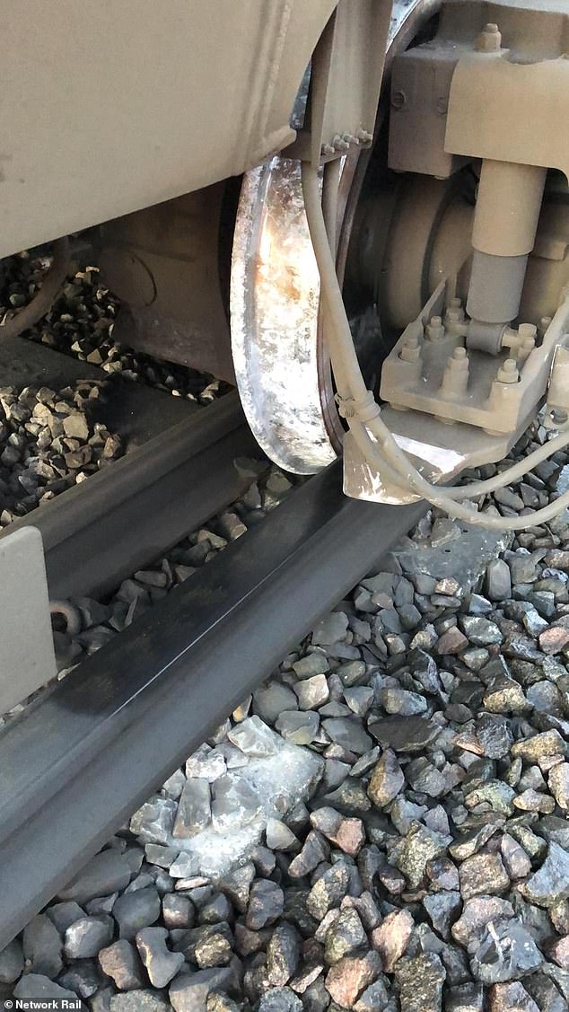 major rail line into london is blocked after train hit an object on the track and derailed - with passengers facing 'do not travel warning' on first working day of fares increase