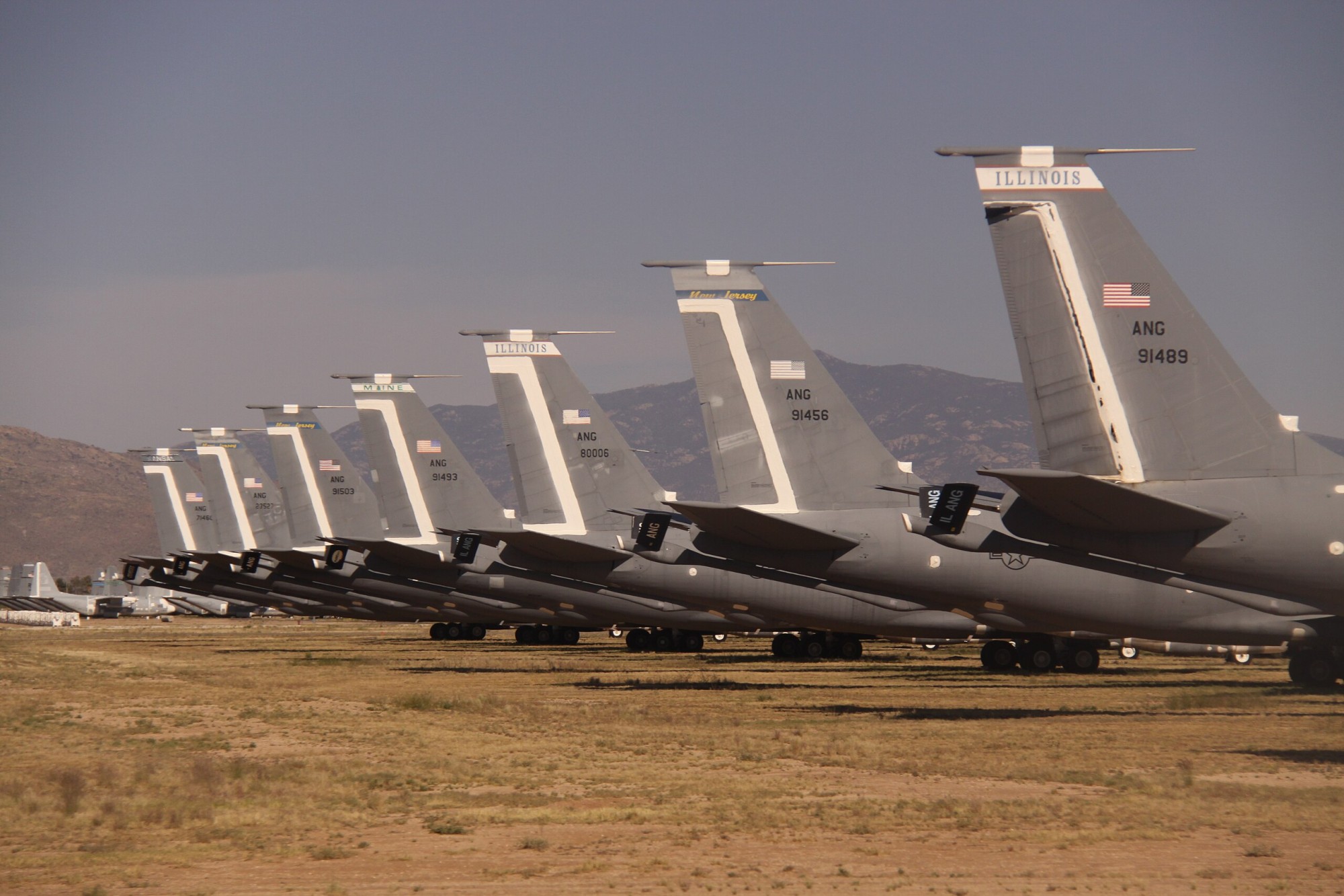 The sheer scale of the graveyard is overwhelming, with thousands of aircraft stretching out across the desert landscape. It's a surreal sight, reminiscent of a post-apocalyptic scene, where human achievements decay in the desert sun.