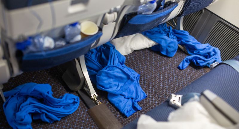<p>Discarding trash, leaving crumbs, or spilling drinks without cleaning up shows a lack of consideration for the crew and the next passengers. Using the provided trash bags and tidying your area before deplaning demonstrates respect for those who work to keep the cabin clean. A clean seat area contributes to a pleasant environment for everyone.</p>